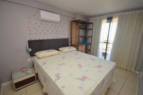 En eller flere senge i et værelse på Fortaleza Rentals