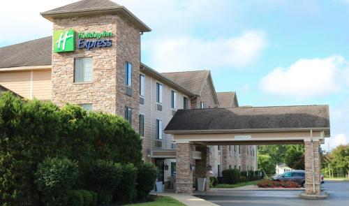 a hotel with a sign on the side of a building at Holiday Inn Express Hocking Hills-Logan by IHG in Logan