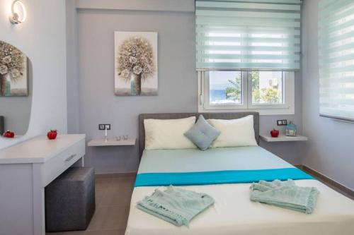 Ένα ή περισσότερα κρεβάτια σε δωμάτιο στο Isalos Apartment