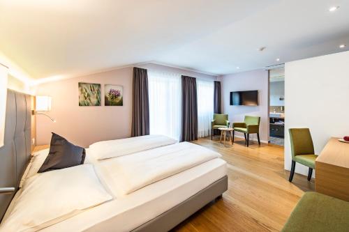 Postel nebo postele na pokoji v ubytování Hotel Jardis