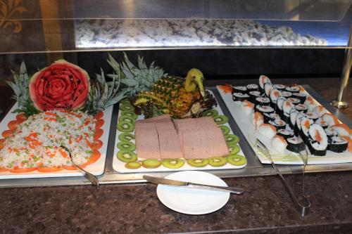a table with several different types of sushi and food at Mix Peymar in S'Illot