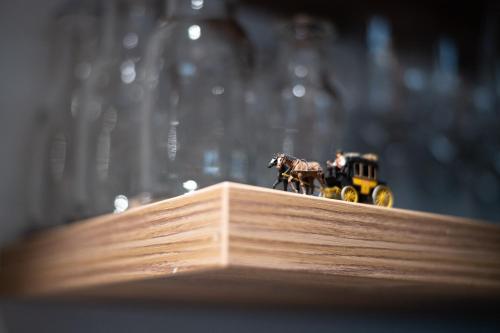 a figurine of a horse and a toy car at Hotel Gerig in Wassen