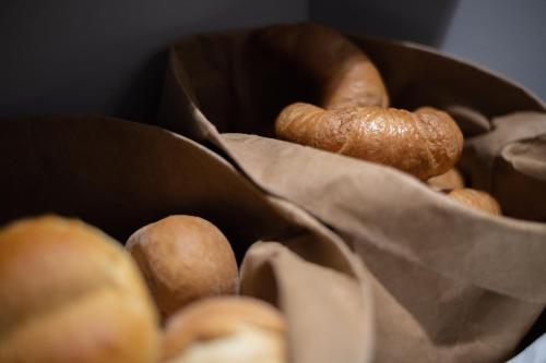 a bunch of donuts in a paper bag at Hotel Gerig in Wassen