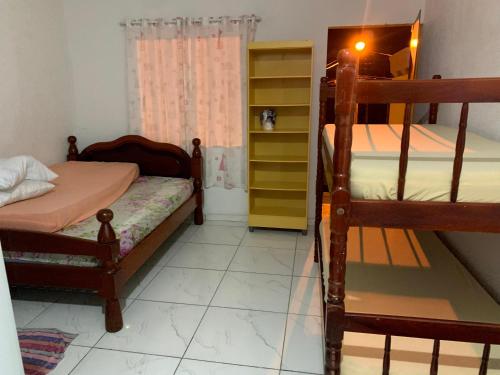 A bed or beds in a room at Kitnet no Coração de Caioba