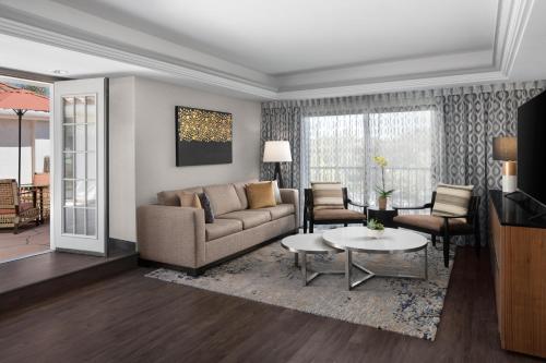 a living room with a couch and a table at Hyatt Regency Westlake in Westlake Village