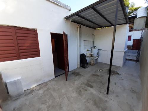 an empty garage with a toilet and a building at El Mirador de La Toma in Cosquín
