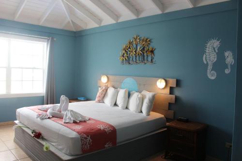 Postel nebo postele na pokoji v ubytování Hideaways Exuma