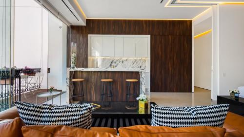 a living room with a couch and a counter at PIER 57 - 709 Stunning View 2 BR Romantic Zone in Puerto Vallarta