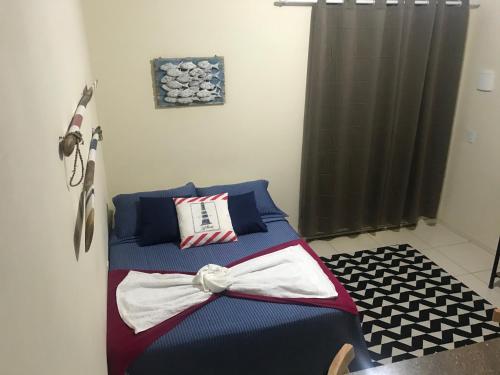 a bedroom with a bed with a bow on it at Descanso do Jordão in Abraão