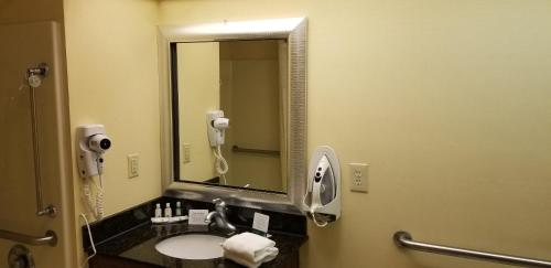 a bathroom with a sink and a mirror at Quality Inn in Bainbridge