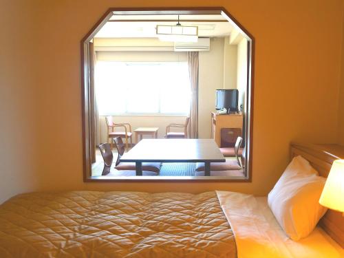 Tempat tidur dalam kamar di Hotel Nankaiso