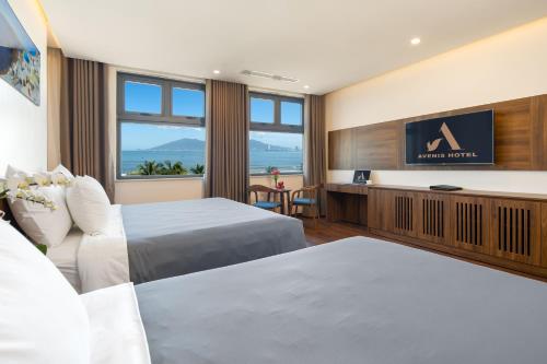 Postel nebo postele na pokoji v ubytování Avenis Hotel