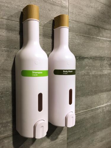 two white bottles sitting next to each other at Kuei Ti Wan Hotel in Checheng