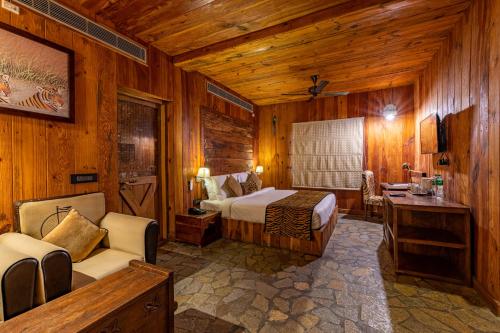 A bed or beds in a room at The Baagh Ananta Elite Ranthambore