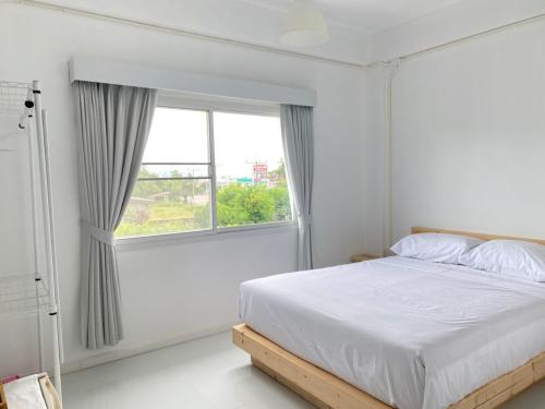 Ένα ή περισσότερα κρεβάτια σε δωμάτιο στο PATRA Agaligotel