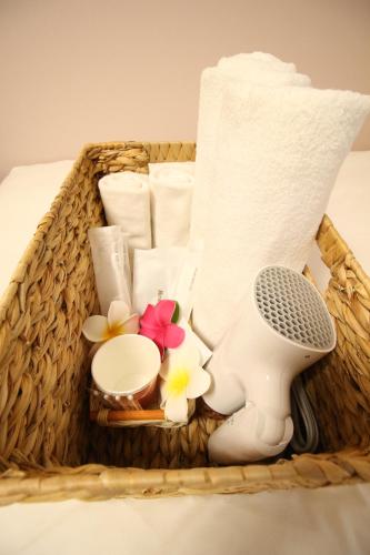 a basket filled with toiletries and a microphone at Okubo Hotel Hawaii in Tokyo