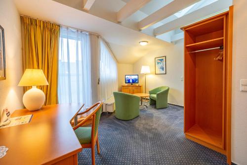Μια τηλεόραση ή/και κέντρο ψυχαγωγίας στο Hotel Rostock West im "Kritzmow Park"