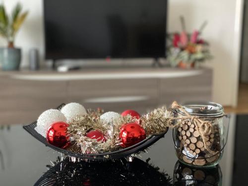 a tray with christmas ornaments on a table at Brand New Apartment, Top Location-Near VIC/Danube in Vienna