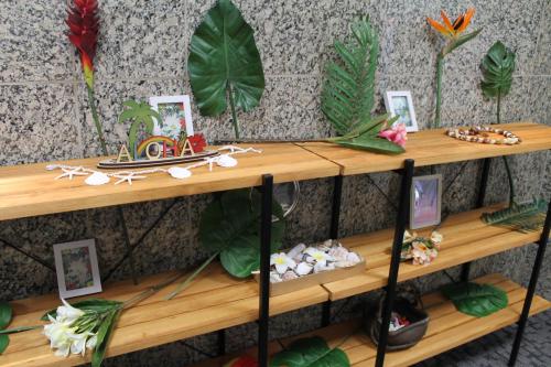 a wooden shelf with some items on it at Okubo Hotel Hawaii in Tokyo