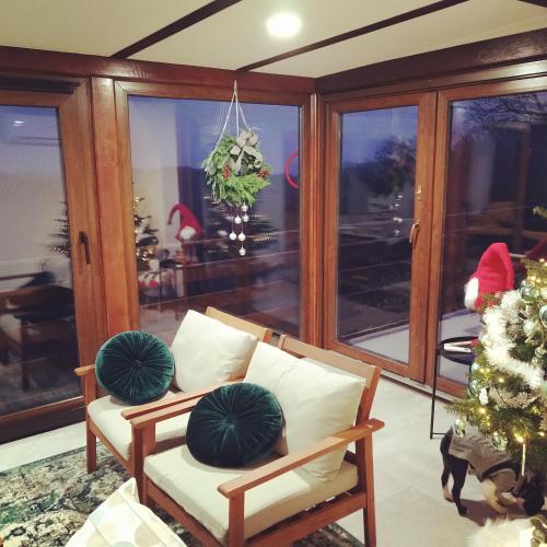 a living room with a couch and a christmas tree at Kuća za odmor Bitoševje in Klenovnik