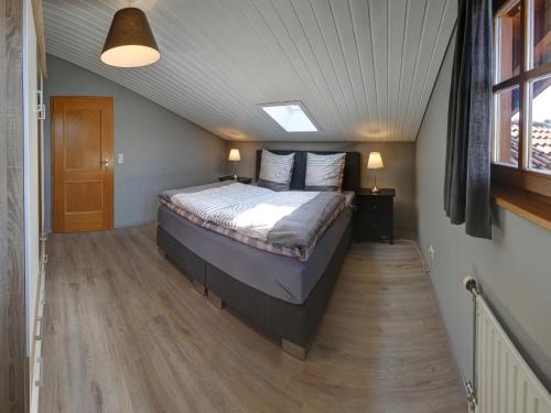 a bedroom with a large bed in a attic at Ferienwohnung Annelies - Chiemgau Karte in Inzell