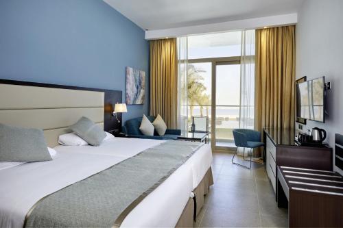 Postel nebo postele na pokoji v ubytování Riu Dubai Beach Resort - All Inclusive