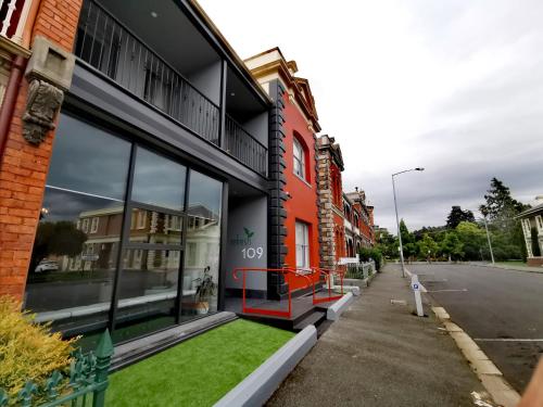 a building with windows on the side of a street at Refresh109 on Cameron in Launceston