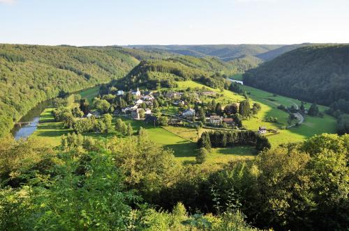 an aerial view of a village in the hills at Gîte de Groupe de la Semois in Alle