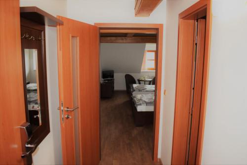an open door to a room with a bedroom at Motel Roubenka in Týniště nad Orlicí
