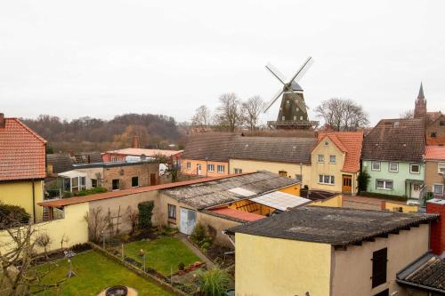 an aerial view of a town with a windmill at Ferienwohnungen Muehlenblick in Röbel