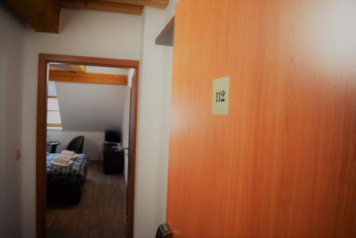 a door with a sign that says life on it at Motel Roubenka in Týniště nad Orlicí