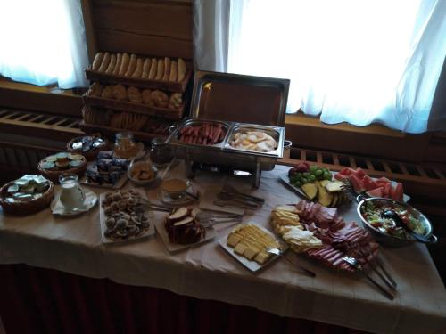 a table with a bunch of different types of food at Motel Roubenka in Týniště nad Orlicí