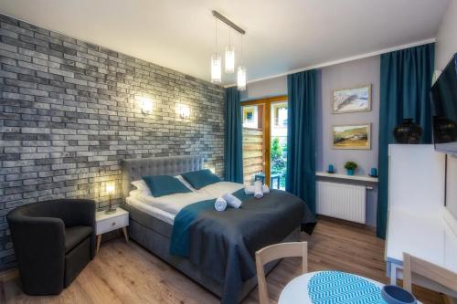 Aparthotel Giewontにあるベッド