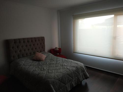 Postel nebo postele na pokoji v ubytování CASA QUINTA