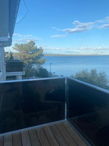 a swimming pool with a view of the ocean at Lučica 360 sea view suite in Nerezine