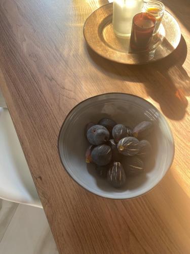 a plate of food on a wooden table at Lučica 360 sea view suite in Nerezine