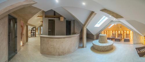 a living room with a large room with a table at Vila Emilia in Vrnjačka Banja