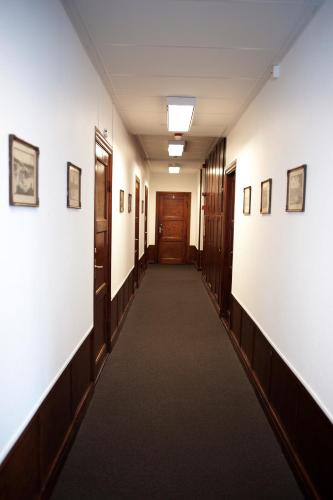 a hallway in an office building with a long corridor at Reftele Wardshus in Reftele