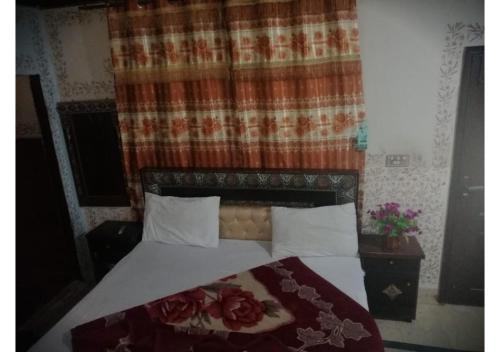 Katil atau katil-katil dalam bilik di Faizan Hotel