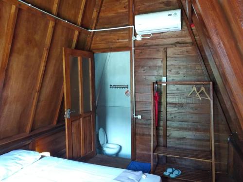 Postel nebo postele na pokoji v ubytování Tanjong Tinggi Cottage