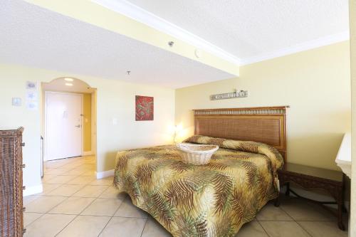 a bedroom with a large bed in a room at Barefoot Beach Club in St Pete Beach