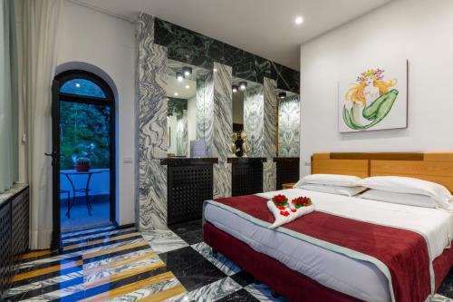 a bedroom with a large bed with flowers on it at Villa La Ventana in Sant'Agnello