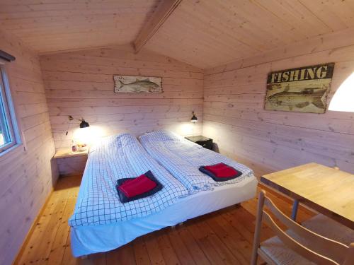 Кровать или кровати в номере Limfjords hytter