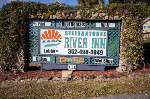 a sign for a riverside river inn at Steinhatchee River Inn and Marina in Steinhatchee