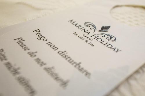 a white card with the words happy anniversary on it at Marina Holiday & Spa in Balestrate