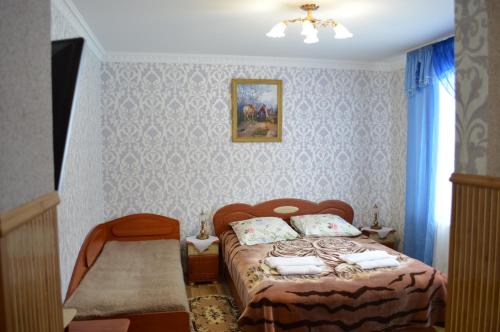 En eller flere senge i et værelse på Котедж Любов