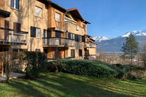 an apartment building with a lawn in front of it at #P0 Le Montbonnot Luminous T2 Garden - Terrace in Montbonnot-Saint-Martin