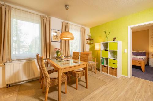 a dining room with a table and chairs at Im alten Rathaus in Bad Liebenstein