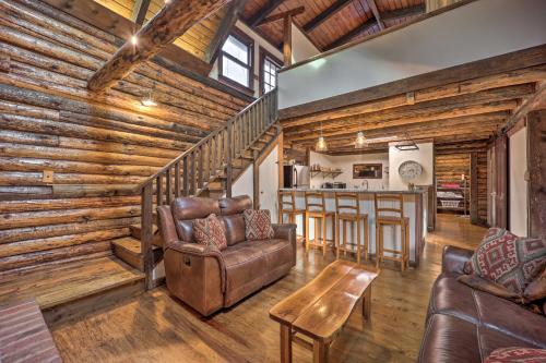 a living room with a couch and a table at Relaxing Retreat with Private Dock on Claytor Lake! in Dublin