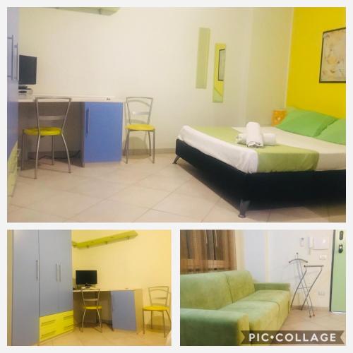 a room with a bed and a table and a couch at La Baia Di Ulisse in Venetico